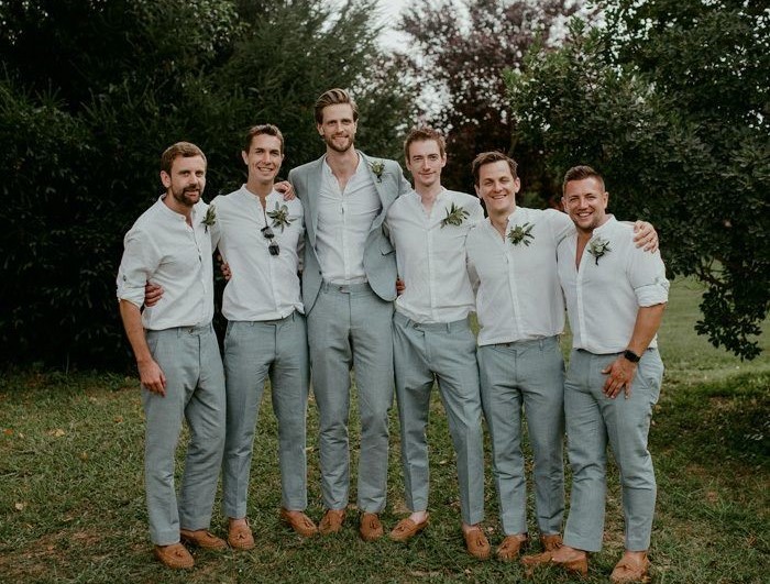 Wedding Season Ready: Wedding Suits for Groom and Groomsmen That Make Men Look Sharp in 2026 Wedding season in 2026 is not just about attending ceremonies — it’s about showing up with style, confidence, and presence. Modern men's fashion has evolved far beyond the traditional black tuxedo. Today, weddings are full of personality, creative venues, and stylish dress codes. Whether you are the groom, a groomsman, or a guest, choosing the right outfit makes a powerful impression. The right wedding suits for groom and groomsmen combine modern tailoring, breathable fabrics, and thoughtful accessories that look incredible both in person and in photos. If you want to step into wedding season looking confident and refined, here are the top outfit trends every man should know in 2026. ________________________________________ Modern Tailored Wedding Suits for Groom and Groomsmen The biggest rule in men’s wedding fashion in 2026 is simple: Fit is everything. The days of oversized, boxy suits are fading. Today’s wedding suits for groom and groomsmen focus on clean tailoring that enhances the natural shape of the body without feeling tight or uncomfortable. A well-tailored suit instantly makes a man look: • More confident • More polished • More stylish Popular colors for groom and groomsmen suits include: • Deep navy • Charcoal grey • Sage green • Beige and sand tones • Classic black for formal weddings Coordinated suits for the groom and groomsmen create a sharp, unified wedding party look that photographs beautifully. ________________________________________ Linen Wedding Suits for Groom and Groomsmen (Perfect for Summer Weddings) Comfort is one of the biggest priorities in 2026 wedding fashion. Many weddings take place outdoors, at beaches, gardens, vineyards, or destination venues. Because of this, lightweight fabrics are becoming essential for wedding suits for groom and groomsmen. Top breathable fabrics include: • Linen • Cotton blends • Lightweight wool • Seersucker Linen suits are especially popular for summer weddings because they provide a relaxed yet elegant look. For example: • Groom in cream or beige linen suit • Groomsmen in light tan or soft blue linen suits This creates a stylish but natural wedding aesthetic. ________________________________________ Statement Blazers for Stylish Grooms 4 While groomsmen often wear coordinated suits, the groom can stand out with a statement blazer. This is a growing trend in 2026 groom fashion. Popular statement blazer styles include: • Floral jacquard patterns • Velvet evening jackets • Deep jewel tones like emerald or burgundy • Subtle textured fabrics This allows the groom to remain visually distinct while still matching the wedding party. ________________________________________ Smart Casual Wedding Looks for Modern Weddings 4 Not every wedding in 2026 requires a full suit. Many couples now prefer relaxed, outdoor, or destination weddings. For these settings, smart casual outfits work perfectly for groomsmen or wedding guests. A stylish smart-casual wedding look might include: • A tailored blazer • Crisp dress shirt • Slim chinos or trousers • Leather loafers or dress shoes This style looks intentional and polished while staying comfortable. ________________________________________ Accessories That Complete Groom and Groomsmen Looks 4 Accessories bring personality to wedding suits for groom and groomsmen. Small details can elevate the entire outfit. Popular wedding accessories include: • Pocket squares • Matching ties or bow ties • Boutonnières (lapel flowers) • Elegant watches • Stylish sunglasses for outdoor ceremonies The key is balance — accessories should enhance the outfit without overpowering it. ________________________________________ Grooming: The Secret to Looking Sharp Even the most expensive suit cannot replace good grooming. Before the wedding day, every groom and groomsman should focus on: • A clean haircut • Trimmed facial hair • Polished shoes • Fresh, subtle fragrance • Well-pressed suits These small details ensure the entire wedding party looks sharp, confident, and photo-ready. ________________________________________ Final Thoughts Wedding fashion in 2026 blends timeless elegance with modern style. From breathable linen fabrics to perfectly tailored jackets, today’s wedding suits for groom and groomsmen allow men to look sharp while staying comfortable throughout the celebration. The goal isn’t just to dress up — it’s to show up looking confident, stylish, and ready to celebrate one of life’s most important moments. Because when the suits fit well, the details are right, and the confidence shows… You don’t just attend the wedding. You arrive.